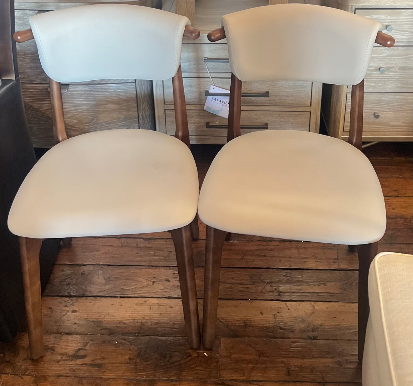 2 minimalist solid wood dining chairs w/ beige padded beige cushion 🪑