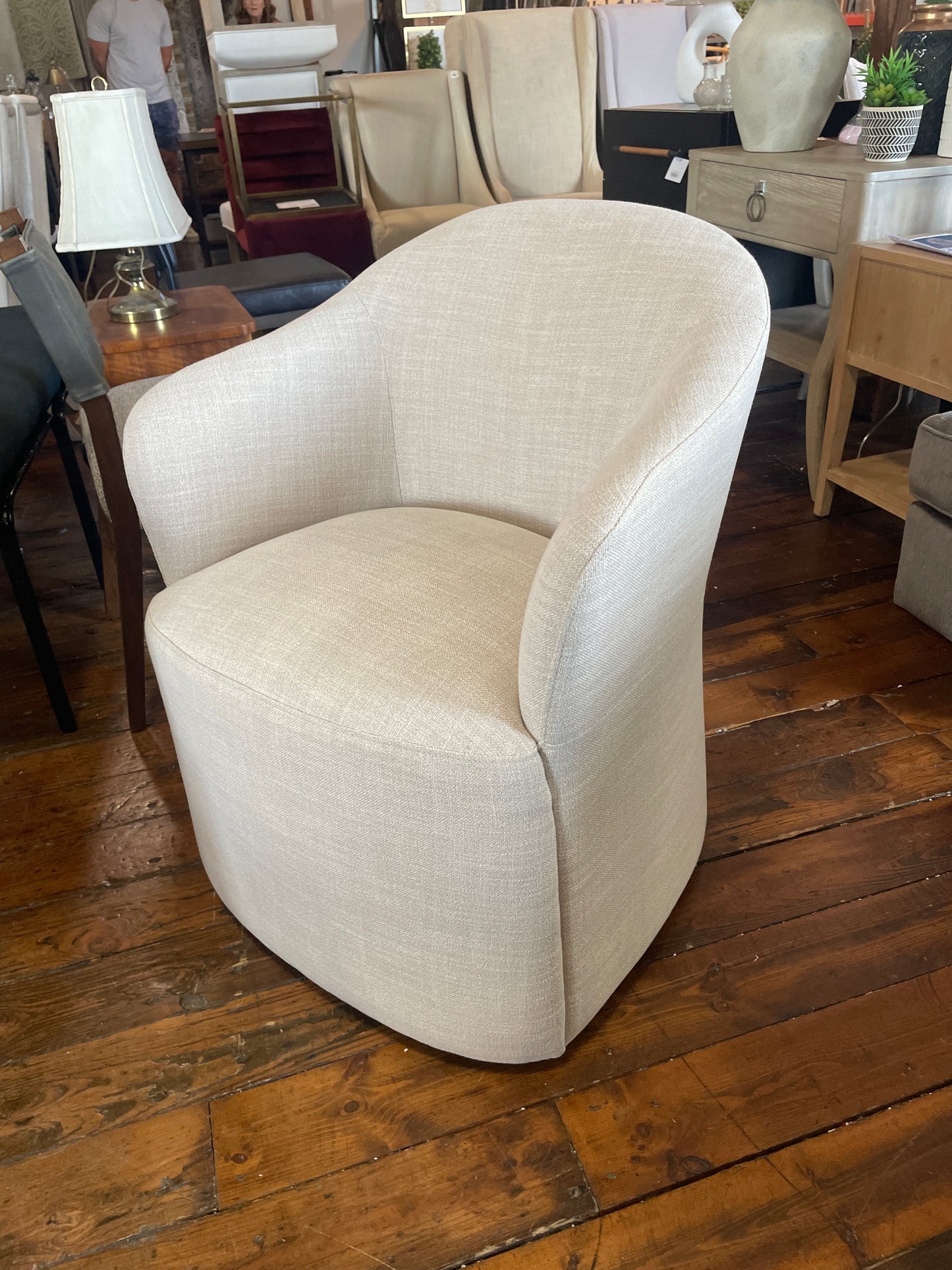 Modern linen upholstered beige chair on casters 🪴