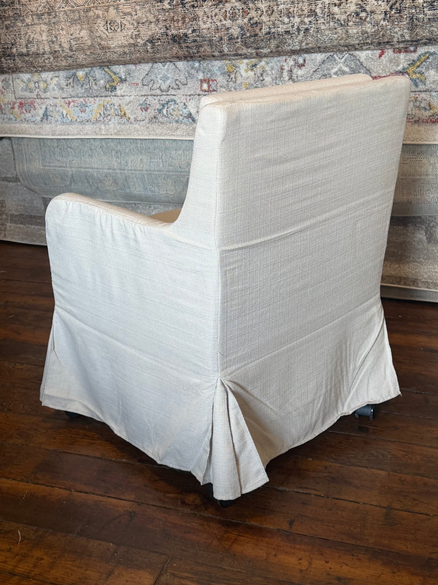 Upholstered cream linen chair on castors 🦋