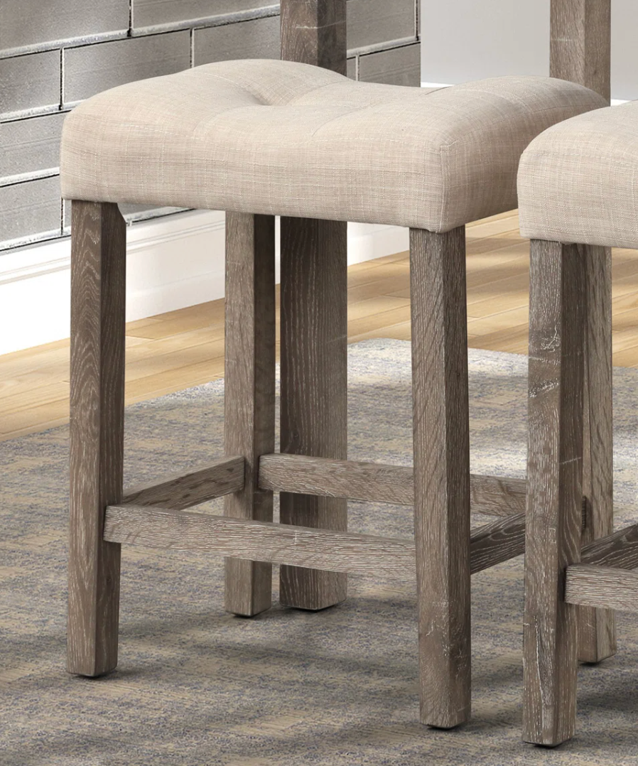 2 beige button-tufted counterheight saddle barstools 🍻