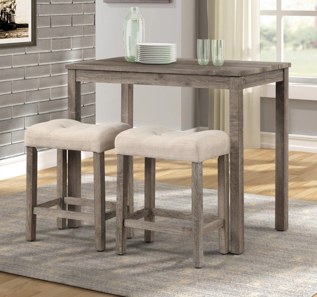 2 beige button-tufted counterheight saddle barstools 🍻