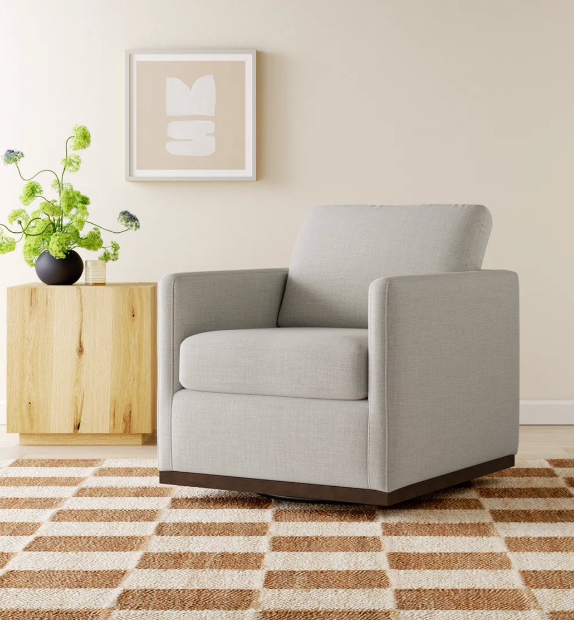 Cream upholstered swivel armchair☕