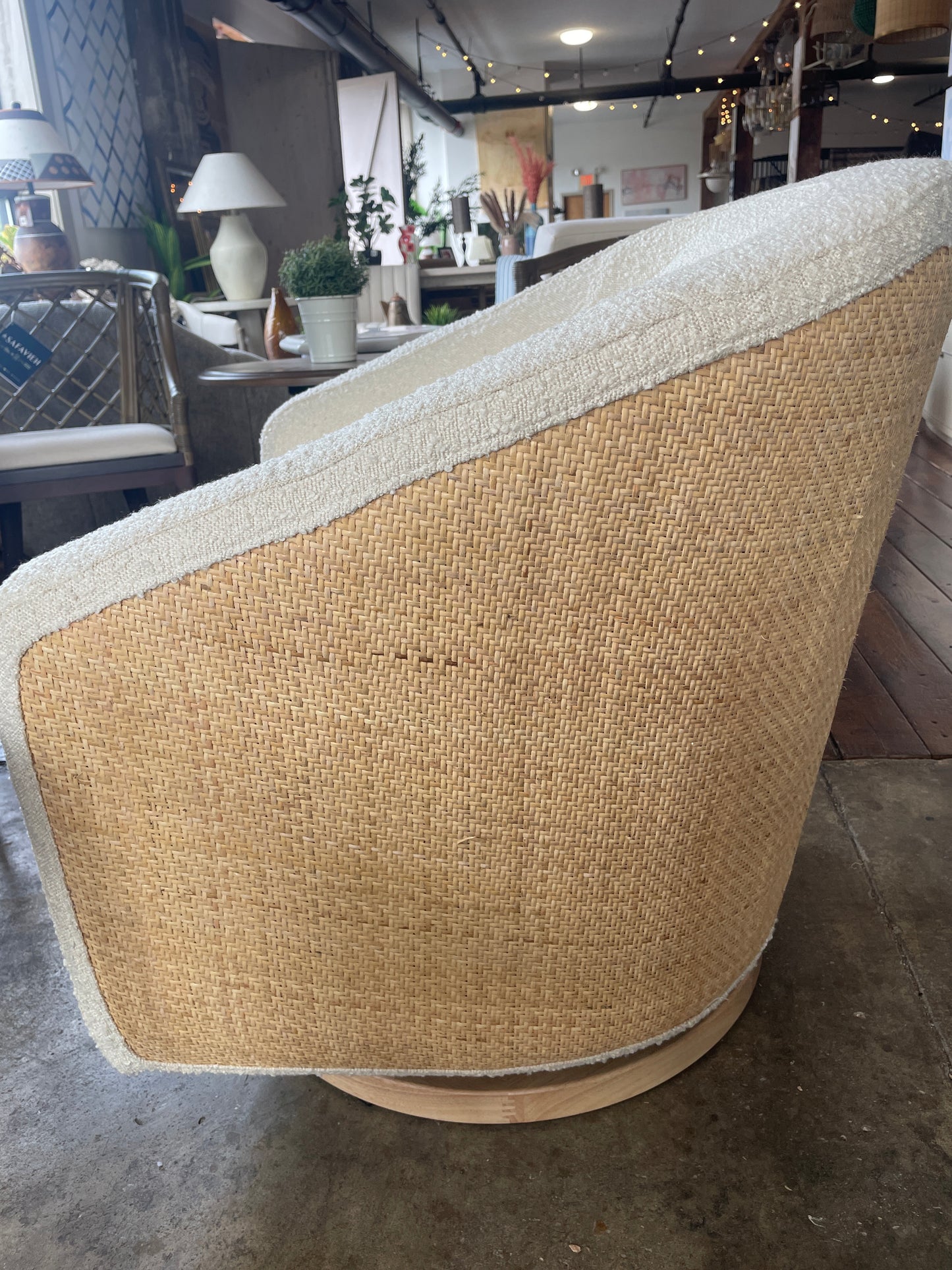 Babyletto swivel glider in ivory boucle w/ cane back & light wood base 🪴