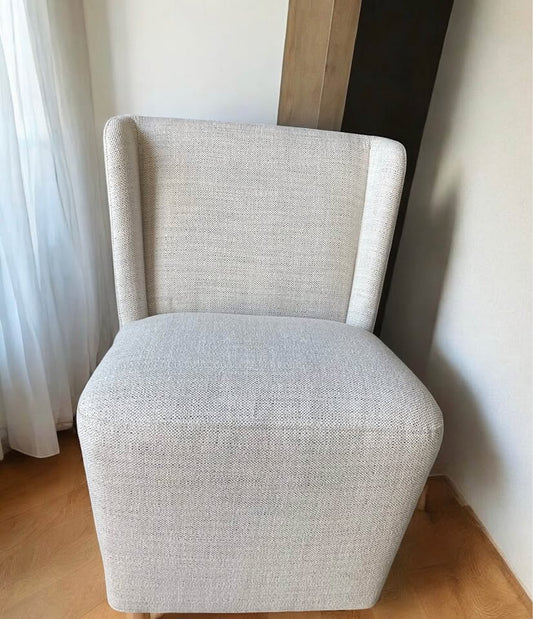 Modern beige linen chair on wheels 🕊️
