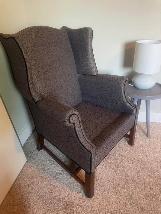Grey upholstered wingback armchair 🩶