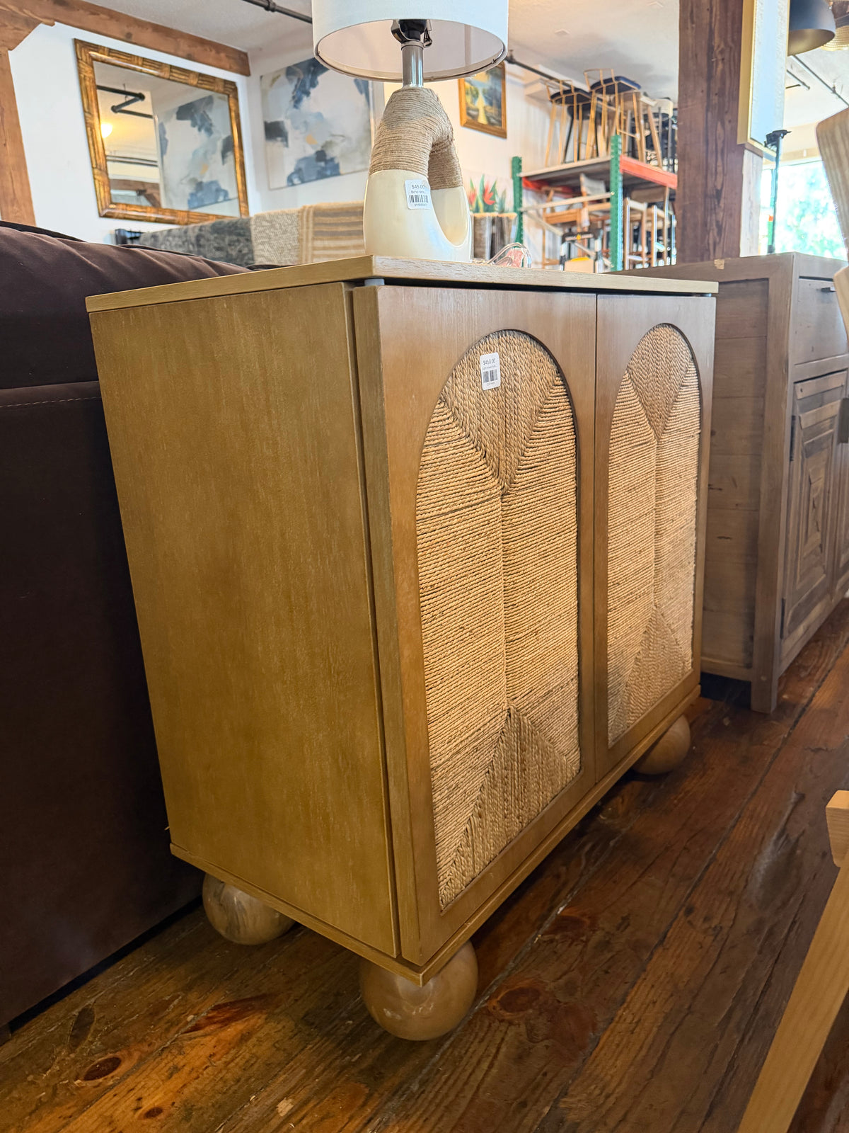 Light brown Nathan James boho entryway storage cabinet w/ natural seagrass & wood doors 🌻