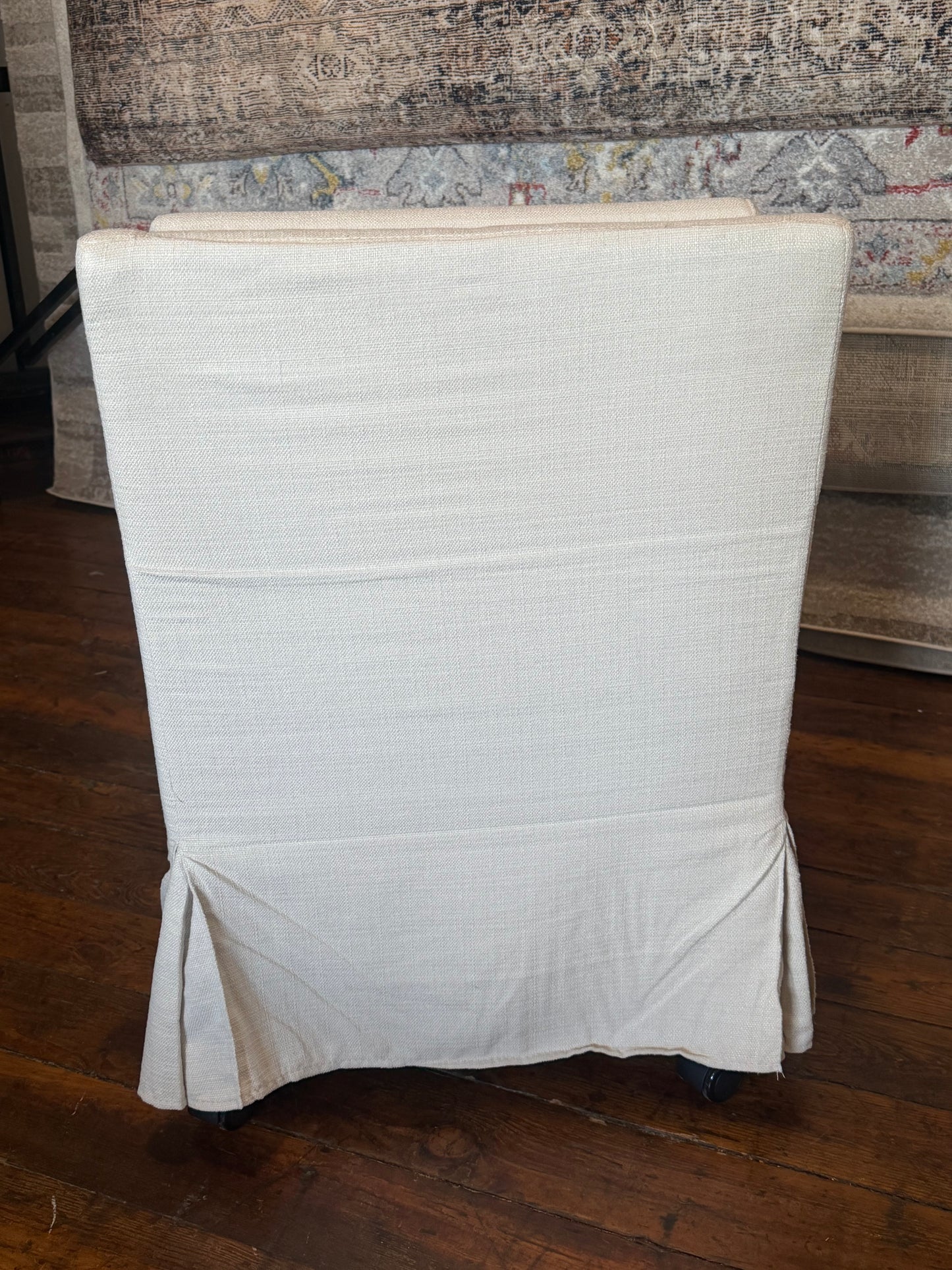 Upholstered cream linen chair on castors 🦋