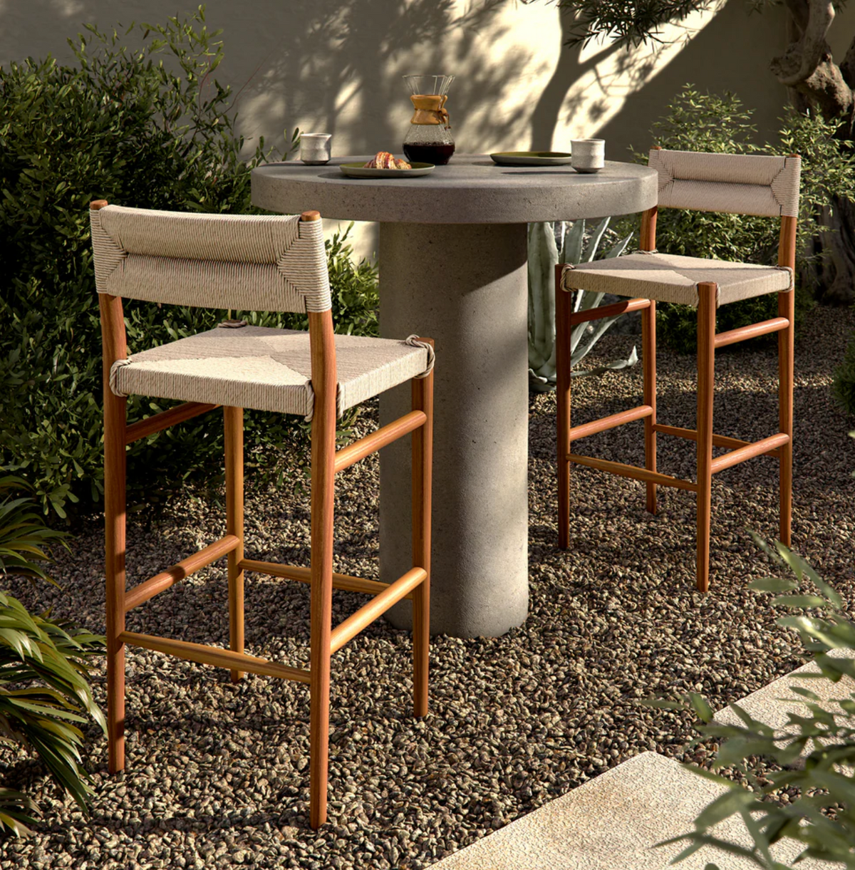 Beige woven Four Hands outdoor barstool 🥂