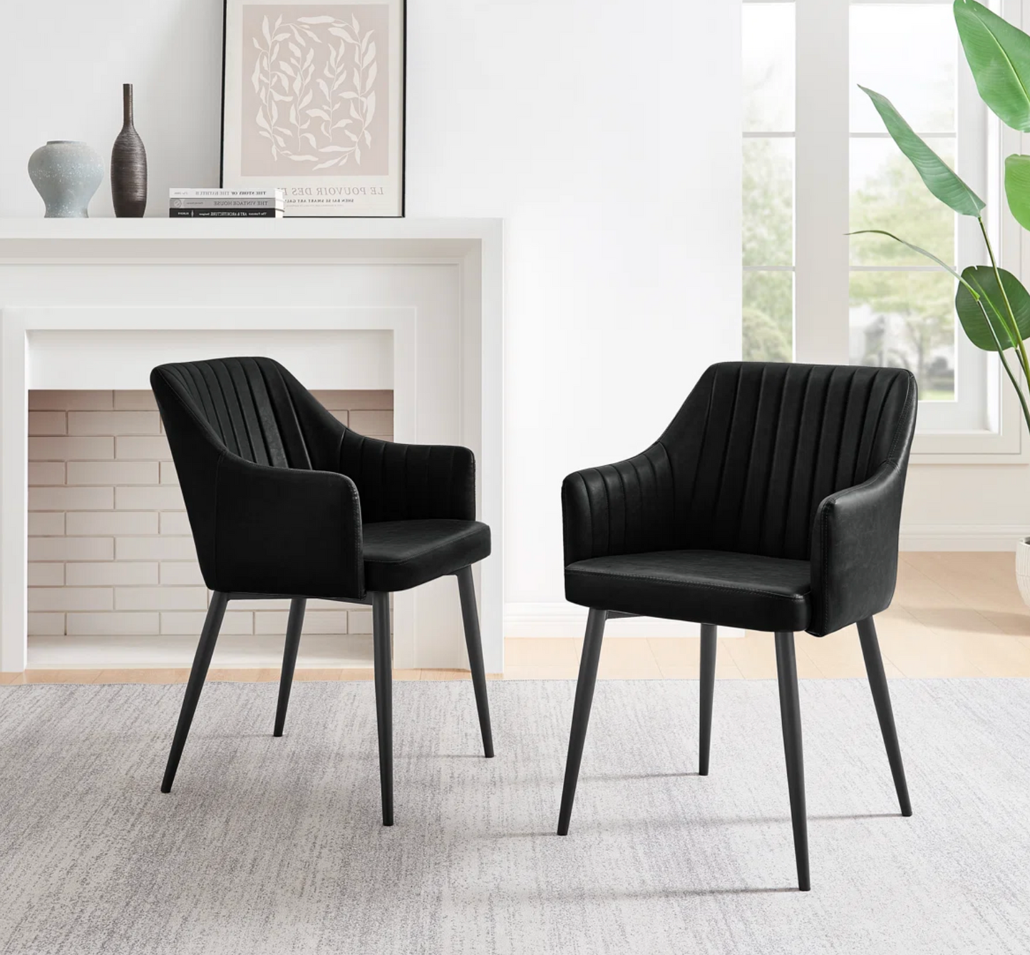 2 black vegan leather dining chairs w/ tapered metal legs🍷